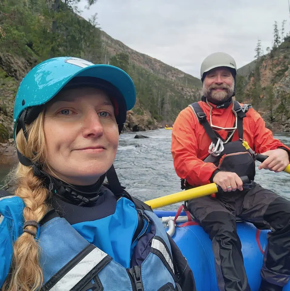 Two people in white rapids posing for a picture